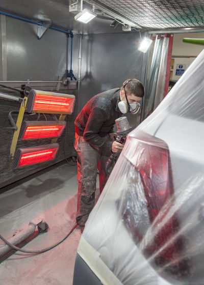 Vehicle spray painting - during
